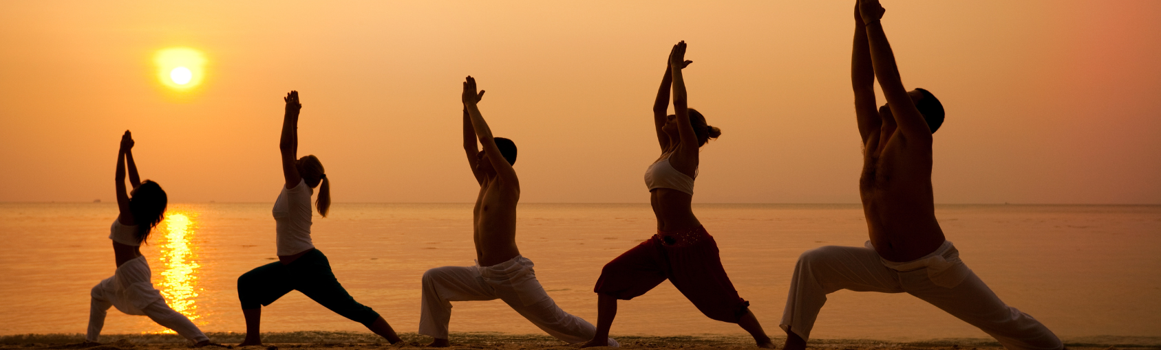 Power of Yoga Image of people doing yoga on the beach